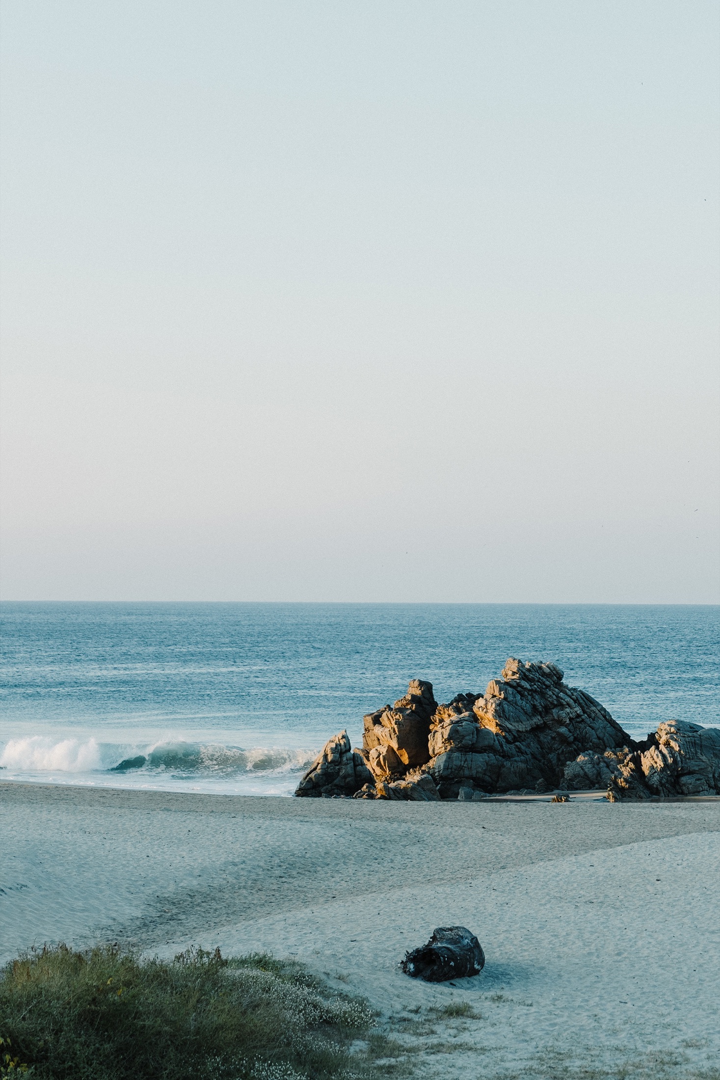 Rocks on Zicatela beach at sunset